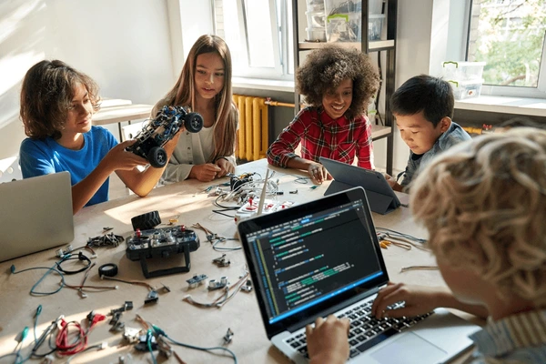 Trump's Push for AI Education in Kindergarten: Pros and Cons 3 diverse school children students build 600nw 2036186204 - Tech Guidely
