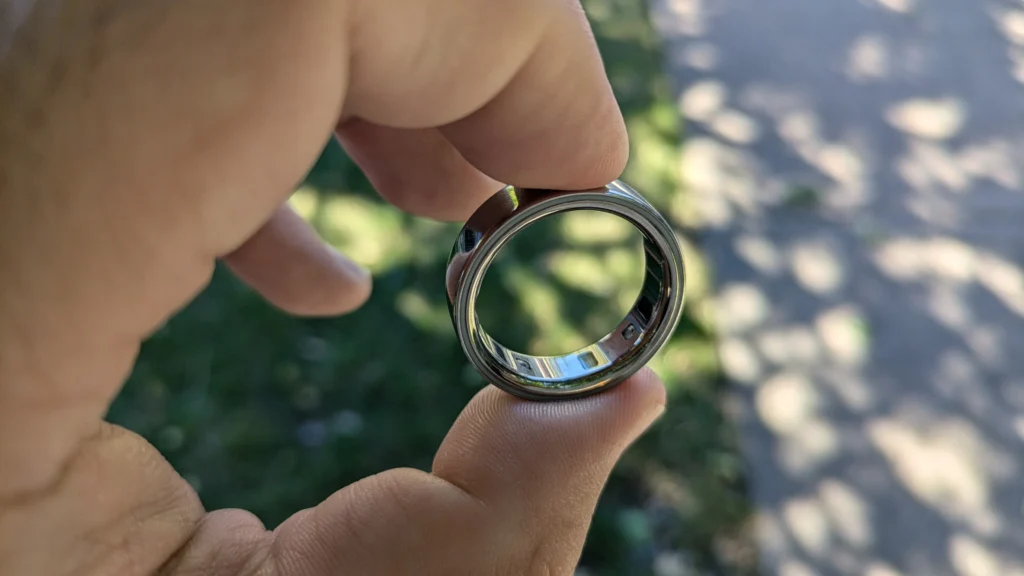 Why the Oura Ring Gen 4 Might Be the Health Tech You Didn’t Know You Needed, Especially on Prime Day 2025 2 Oura Ring Gen 4 on hand with glowing sensor